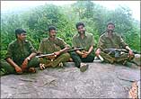 Veerappan with journalist R Gopal and gang members