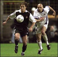 Angel Salgado (L) run with Anderlecht's Ivica Mornar 