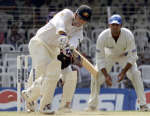 Justin Langer on way to his century