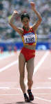 Wang Liping crosses the line to win the 20km walk. REUTERS/Ian Waldie 