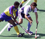 India's Thirumal (L) battles for possession with Argentina's Matias Vila REUTERS/Yves Herman 