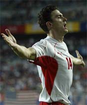 Marcin Zewlakow celebrates scoring the third goal for Poland.